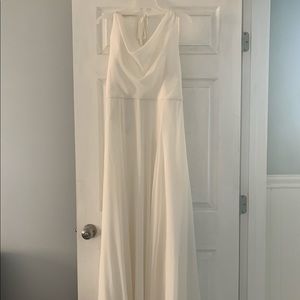 A Gamberdella, floor length, paper white dress.